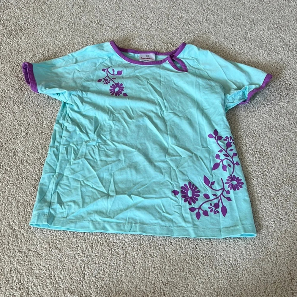 Brand New Never Been Worn Turquoise Blue Shirt with Purple Flower accent!